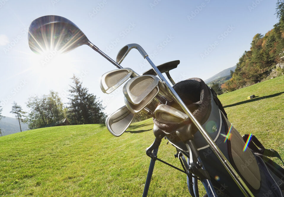 Italy, Kastelruth, Golf clubs in golf bag on golf course